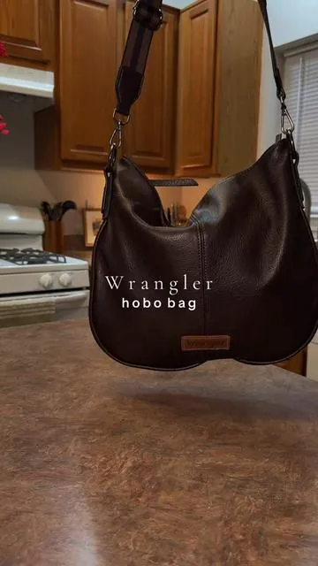The side details 😍 @Rustic Charm Bootic #purse #pursetok #leatherbag #wranglerpurse #hobobag 