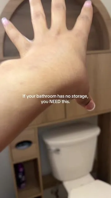 This arched over the toilet storage cabinet elevated my bathroom 🫧 #bathroomcabinet #toiletstorage #storagecabinet #bathroomstorage #bathroomupgrade 