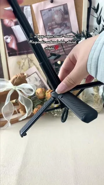 Content creators & lazy queens UNITE🙋‍♀️ This magnetic phone stand is your new ride-or-die📱 Strong magnetic attach (no drops ever!)🧲, stretch for selfies/vlogs 🎥, fold compact for desk streaming/binging📺 Sturdy tripod base, perfect for 100% hands-free use💯 Your new favorite phone accessory just dropped!#tiktokmademebuyit #tiktokshop #selfie #selfiestick #musthave 