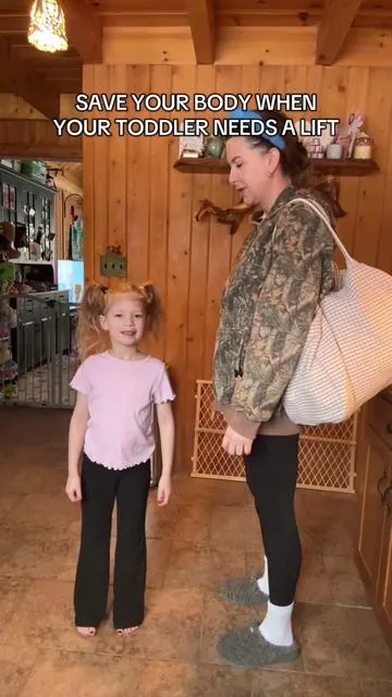 When your toddler wants to be carried, use the toddler sling and save your body. Carry them comfortably up to 55lbs.  #babyshowergifts #babyessentials #momessentials #babycarrier #giftforbaby @tushbaby 