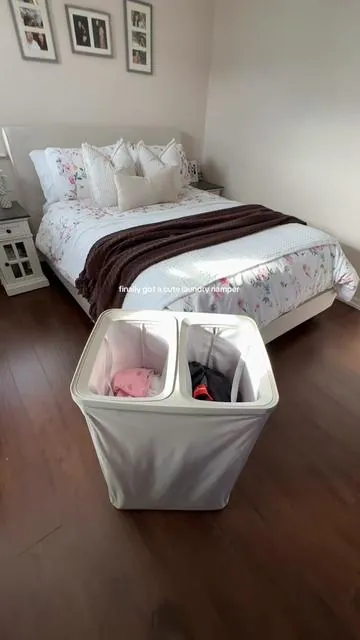 An aesthetic laundry hamper that actually makes life easier. Dual-sided, clearly labeled lights / darks, and keeps everything looking put together 🧺✨ #laundry #laundrytok #laundrybasket #laundryhamper #tiktokshop        
