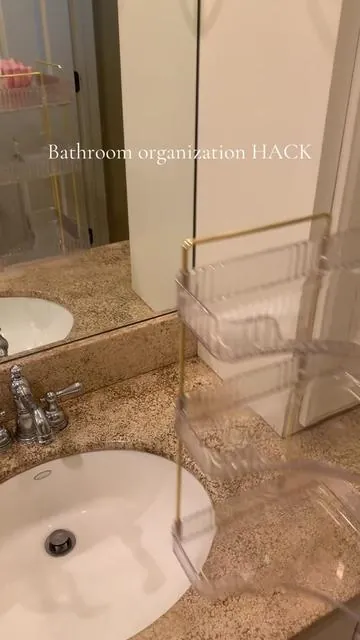 3-tiered corner organizer that is perfect for smaller bathrooms! #bathroomorganization #bathroomorganizer #bathroomessentials #cornerorganizer #bathroomcleaning 