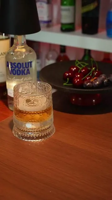 The glow in the glass understands the night better than the lights do.🧊🥃🎵#Tipsy #WhiskeyGlass #Whiskey #drink #glass #cup 