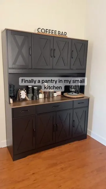 I swear this cabinet holds way more than it should #kitchendecor #coffeebar #kitchenstorage #pantrycabinet #kitchenorganization 
