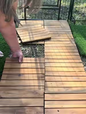 If you’re trying to create a walkway in your yard without pouring concrete, this is such an easy option. These interlocking wood deck tiles snap together and can be used for patios, pathways, balconies, or any outdoor space. We used them to build a path through our backyard and found them right here on TikTok shop.     #decktiles #backyardideas #diywalkway #outdoorliving #TikTokSpringGlowUp