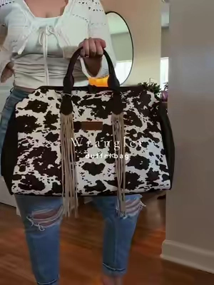 In love with this duffel bag 🤎 @Rustic Charm Bootic #purse #pursetok #wranglerpurse #duffelbag #luggage 