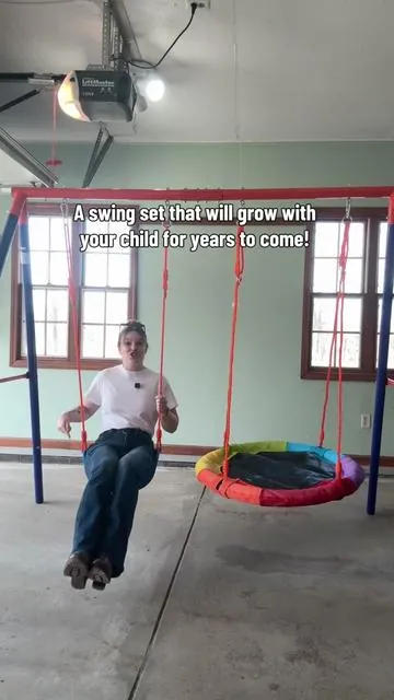 This swing set is so perfect! A little swing and a saucer swing we absolutely love the saucer swing!  #swings #swingset #saucerswing #backyardfun #outdoorplay 