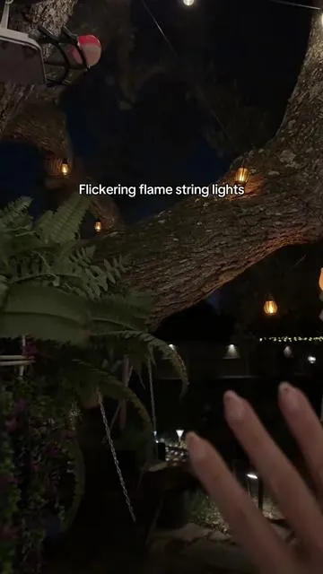 Solar flame, flickering lantern, string lights, perfect in the backyard! #FlickeringLights #FlameLights #SolarStringLights #StringLights #SolarLighting 