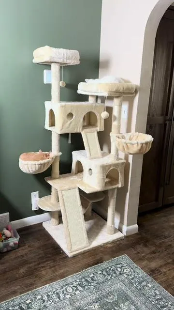 65 inches tall, multi-level cat tree! Comes in several different colors/pattern options. It has a little bit of everything and is very sturdy. Check it out! @HOOMIC #cattree #catplayground #catessentials #cat #cats 