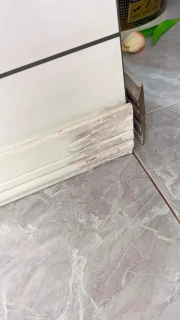 The easiestaseoadffixhuerilusok shop squeeze, smooth & done. No paint	3	 needed,matches most white trim perfectly #NoPaintNeeded#BaseboardSolution #HomeHacks101 #DIYEasy #quickrepair 
