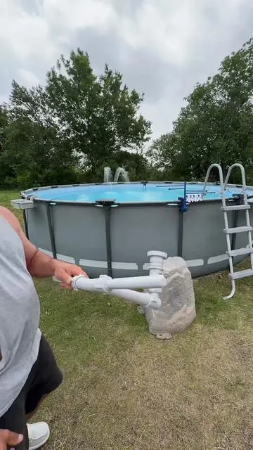 Swimming pool water fountain.