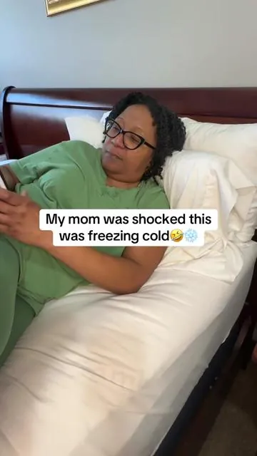 My mom couldn’t handle how cold this was🤣🥶 #coolingblanket #blanket #menopause #hotflashes #nightsweats 