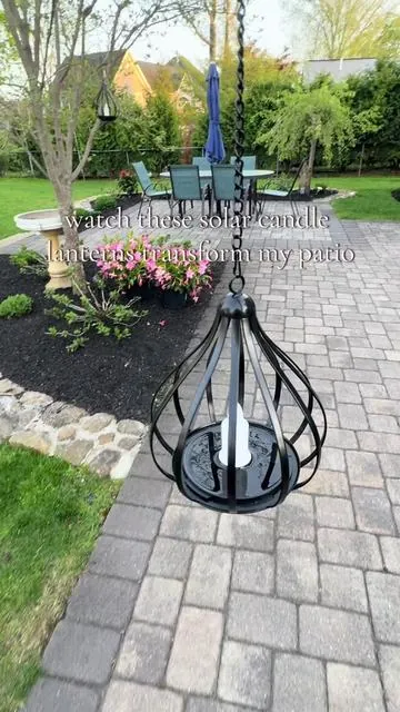 These solar flickering candle lights instantly made my patio feel cozy and romantic. They charge during the day and come on automatically at night. No wires and no batteries required. The price for a set of two is so low! #patioseason #solarlights #outdoorlighting #cozyathome #backyardvibes 