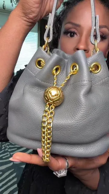 This fabulous handbag looks just like a vintage French designer. The leather is top-tier.