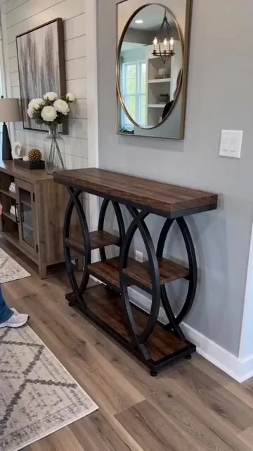 Transform your entry or living area with smart storage! This 39.4" industrial console table is designed for small spaces, offering 4 tiers of organized storage. The narrow wood design adds a stylish accent to any hallway or room, maximizing your layout without compromising on style. Perfect for displaying decor or keeping essentials tidy. Tap to shop and elevate your home decor! #fyp #consoletable #smallspaceliving #hallwaydecor #AIGC #Moras