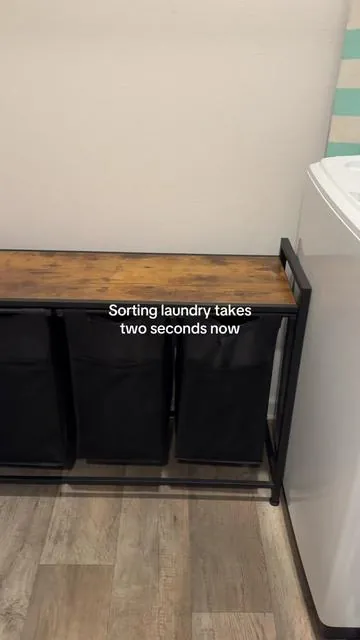 Laundry room essential I didn’t know I needed!! This 3-section laundry hamper just got restocked and sells out fast. Go grab yours!! #laundryhamper #momhacks #laundryorganization #tiktokshopmemorialday #summerturnup 