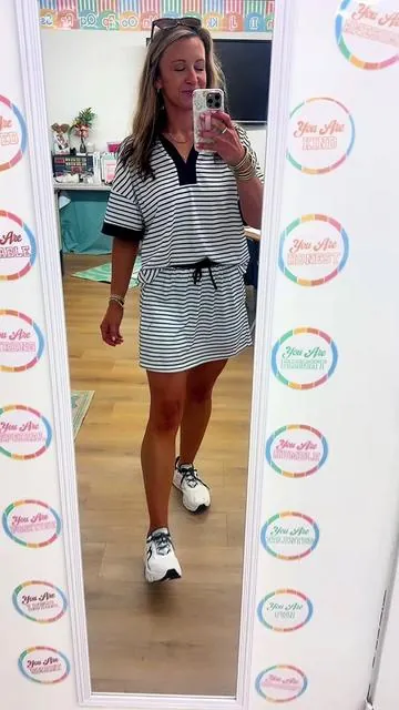This striped 2 piece set is lightweight, buttery soft, and perfect for busy teacher days, errands, or ball field nights! The relaxed fit + pockets = an instant favorite. #twopieceset #matchingset #skorts #summerstyle #momstyle 