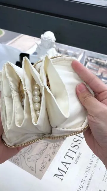 You know that panic when you reach into your bag and your necklace feels like a bird's nest? This pouch turns that panic into a quiet zip. #jewelrypouch #jewelrystorage #jewelryorganization #jewelryorganizer #GraduationGifts