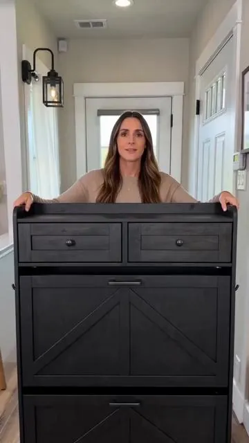 Say goodbye to entryway clutter! 👋 This farmhouse narrow shoe cabinet is your new organizing hero. It features 2 flip drawers for shoes, handy top drawers for essentials, adjustable shelves, AND hooks – perfect for coats or bags! A freestanding solution that brings tidy style to your hallway or foyer. Maximize your space and keep things neat. Tap to shop and get yours today! #shoesolutions #entrywayorganization #farmhousefurniture #homestorage #AIGC #Moras