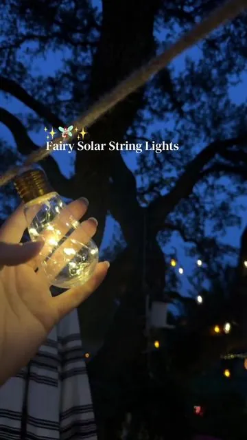 Boho whimsical fairy solar powered string lights for your outdoor patio! I love that these are on a rope with the twinkling fairy lights in the bulb and you can change their flashing mode! Give you the perfect ambience in your backyard! #SolarStringLights #FairyLights #StringLights #DealsForYouDays #TikTokShopMemorialDay 