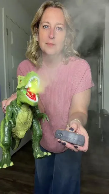 Remote control dinosaur that can walk and has a mist spray that changes color. #kidstoys #dinosaur 
