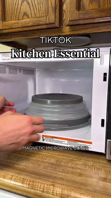 This magnetic microwave cover is soooo much more convenient to use and store than the traditional ones. Just raise and stick to the top of the microwave when not in use so it stops constantly getting left on the counter! #hovercover #microwavecover #kitchengadgets #kitchenappliances #KitchenHacks 
