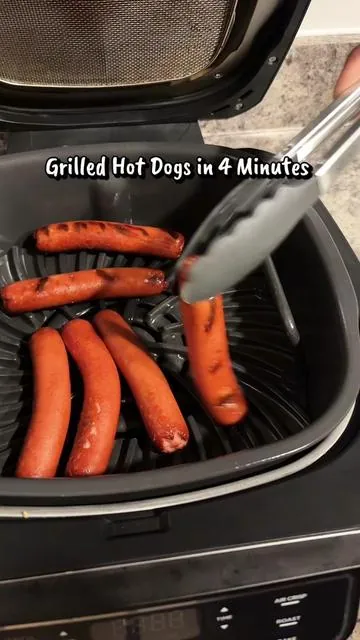 This is the only way I’m making grilled hot dogs!✨  Here’s How: Preheat Ninja Foodie Grill Setting on High for 4 minutes and flip HotDogs at 2 Minutes and then Enjoy🌭 #indoorgrill #hotdogs #ninjafoodi #easyrecipe #dealsforyoudays 