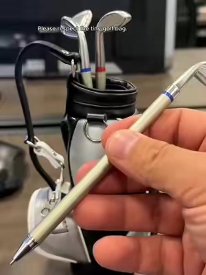 A tiny detachable golf bag pen holder. I fully support it.#WeirdFinds #GolfGift #CuteDeskFinds #TikTokMadeMeBuyIt #deskaccessories 