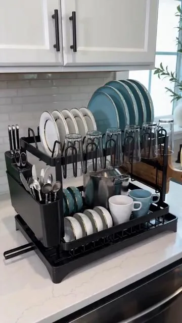 Say goodbye to kitchen clutter! 👋 This smart 2-tier dish drying rack is your ultimate space-saving solution. It comes with a built-in drainboard to keep your counters dry and a detachable design for easy cleaning. Plus, it's foldable for effortless storage when you need extra space. Get yours in sleek black today and transform your kitchen routine! Shop now! #kitchenorganization #dishrack #dealsforyoursdays #AIGC #Moras