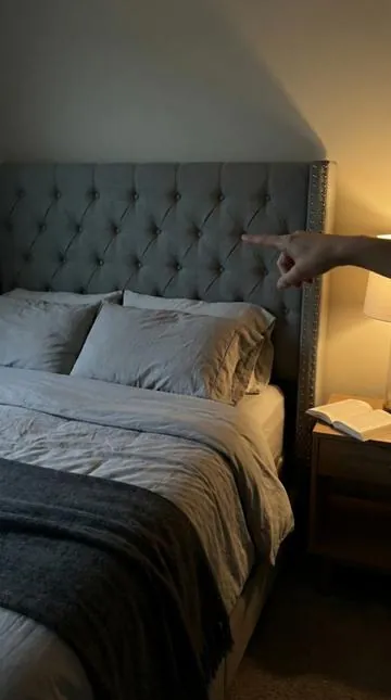 This grey wingback bed makes my bedroom feel like a moody boutique hotel. Tall tufted headboard, hand applied nailhead trim, under two hundred dollars. 🌙🛏️ #BoutiqueHotel #BedroomRefresh #TikTokShopFinds