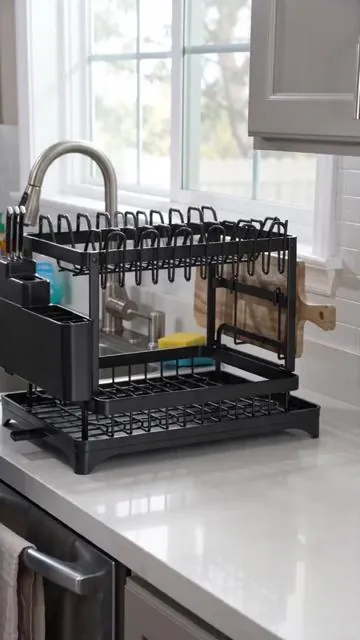 Say goodbye to countertop clutter! 👋 This 2-Tier Dish Drying Rack keeps your kitchen organized and tidy. Featuring a practical drainboard, it helps maintain a dry surface. Its detachable design offers flexibility, and it's foldable for smart storage when not in use. A sleek, black kitchen gadget that makes daily tasks easier. Shop now and elevate your kitchen space! #kitchenorganization #dishdryingrack #DealsForYouDays #AIGC #Moras