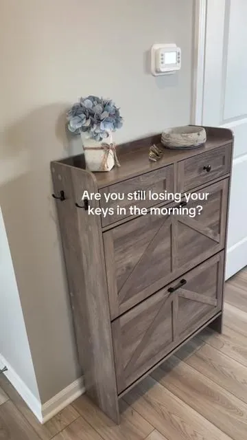 No more entryway clutter with this narrow shoe cabinet you will never guess all the things you can put in this and remove the eyesore as visitors into your house ##entryway##shoerackorganizer##shoeorganizer##shoerack##storagehacks