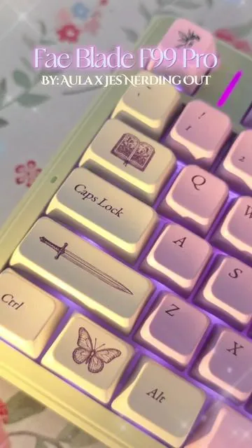 A whimsical & bookish, romantasy themed, fairycore aesthetic keyboard ♡  ~ for the fantasy romance book girlies, to bring some magic to our desks. Muted sage greens, lilac, and soft pinks 🫶🏼 I hope you love it too 🧚‍♀️✨️📚 Fae Blade F99 Pro Aula x @Jes Nerding Out 🤓💕  Mechanical Keyboard Hot Swappable Wired or Wirelss Leobog Flower Field Linear Switches or Leobog Rose Silent Tactile Switches #booktok #romantasy #keyboards #desksetup #fairycore 