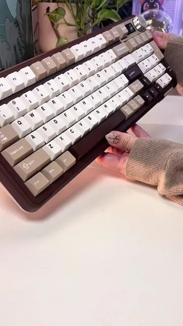 Also think it’s on sale as of rn🤎The A99 pro is such a beautiful keyboard 🫠 So glad they made it full size 🤩🤎🤎 🤎It is hot swappable so you can change out the switches to change the sound or the keycaps to adjust the look . 🤎Two stage height adjustment flippy feet 🤎Tri-mode connectivity ( usb-c, BT, 2.4Ghz)  . . . . . . . . . . . @SOLAKAKA Direct #dealsforyoudays #ticktockshopcreatorpicks #summervibes #fathersdaygift #weeklydeals . . . . . . . . . . Keyboard, good keyboard, neutral aesthetic, brown keyboard, creamy keyboard, thocky, neutral aesthetic, full size keyboard, on sale , Solakaka a99 pro
