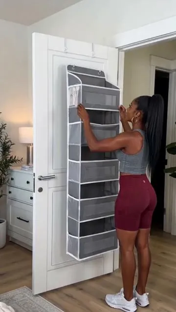 Tired of clutter taking over your room? 😩 This Over-the-Door Hanging Storage Box is your ultimate secret weapon for a tidy space! With 4 tiers and large pockets, it's perfect for organizing everything from toiletries to snacks in your bedroom, bathroom, or pantry. Get ready to reclaim your space with this compact, functional, and sturdy solution. ✨ Shop now and transform your home! #homeorganization #spacesaving #doorstorage #pantryhacks #AIGC #moras 