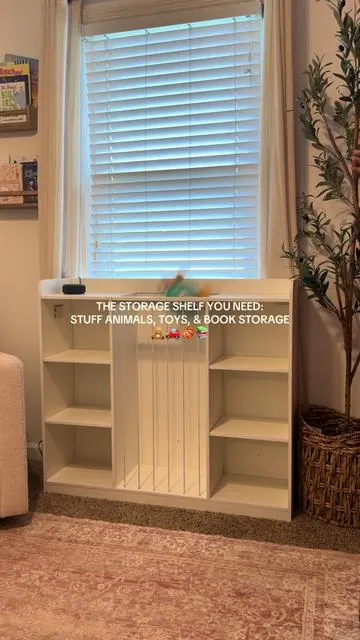 This storage organizer helped me keep the toys, books, and stuffed animals all in one place! Perfect for my daughters room and perfect for a play room!  #toystorage #toddlermom #storageshelf #kidsroomdecor #organizedhome 