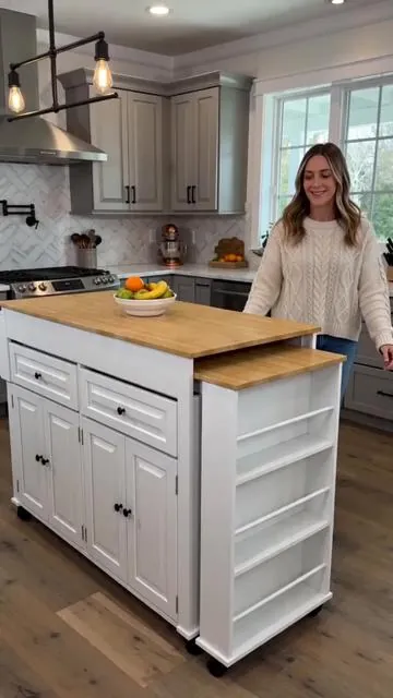 Maximize your kitchen's potential with this extendable island! Go from 80" to 48" for extra dining or prep space when you need it. Power up appliances easily with the convenient built-in outlet. Enjoy smart storage with 2 smooth-gliding drawers and 3 rows of open shelves to keep everything tidy. This mobile rolling cart makes reorganizing your space simple. Pick your perfect shade: White, Black, Brown, or Blue. Tap to shop and enhance your home today! #kitchenorganization #homehacks #DealsForYouDays #AIGC #Moras