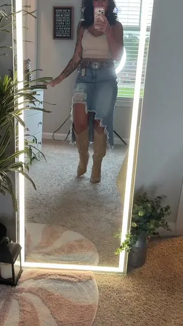 This denim skirt is giving country concert, girls’ night, date night, and weekend brunch all in one. 😍 The distressed details, front slit, and asymmetrical hem make it stand out from your typical denim skirt. Pair it with cowboy boots, sandals, tanks, graphic tees, or bodysuits and you’re set. And can we talk about how flattering this cut is? 🔥#westernstyle #denimskirts #distresseddenim #SummerVibes #dealsforyourdays 