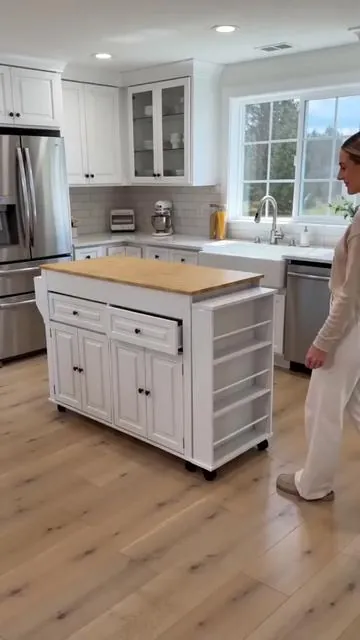 Upgrade your kitchen setup with this incredibly versatile island! ✨ It features an extendable design, perfect for extra prep space or a cozy dining area when you need it. Keep devices charged and appliances handy with the built-in power outlet, right where you cook. With two storage drawers and three open shelves, you'll have plenty of space for all your kitchen essentials. Plus, it's a mobile cart, so you can easily move it around your home. Available in stylish colors to complement any decor! Ready to organize and optimize your kitchen? Tap to shop this essential! 👇 #kitchenisland #homeorganization #DealsForYouDays #AIGC #Moras