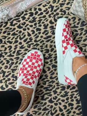 These red checkerboard slip-ons are such a fun twist on a classic and the perfect pop of color for summer outfits. #checkeredvans #redandwhite #vansstyle #casualstyle #sliponshoes 