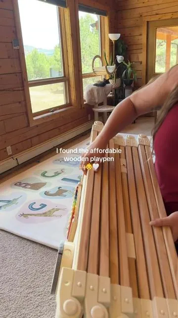 My baby was reorganizing my kitchen every day until I got this. 😅🤎 #woodenplaypen #babyplaypen #crawlingbaby #babyproofing #playpen 
