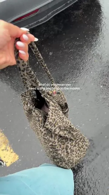 bringing allll the snacks 🤭 #moviedatenight #totebag #fyp #snackbag #leopardprint 