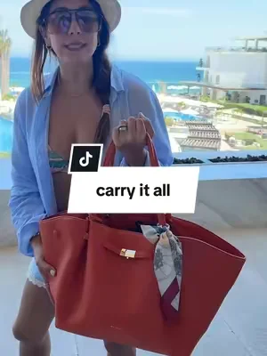 Replying to @Sondra Newbella Marella totes is elegant combining style & practicality.  Includes Tailored luggage strap,magnetic closure, detachable charm key ring, and compartments holding everything! #newbellamarella #leathercarryall ##dealsforyoudays##carryonpurse