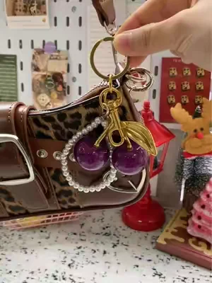 If you have a simple plain purse this cute cherry charm will make it look better #Cherry #Charm #TikTokShop #Fyp #ParaTi 