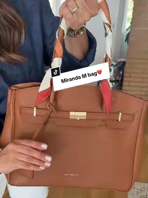 NEW!! Gorgeous Miranda M tote that holds it all! Magnetic closure and slides on carry on for travel too. #dealsforyoudays #tiktokshopcreatorpicks #leatherhandbags #leathertravepurse #designerpurses@Newbella.Fashion 