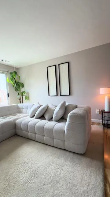 Nothing beats cozy lights and a couch you never want to leave. ✨☁️ #CozyHome #livingroom #homeinspo #bonelesscouch #cozyathome