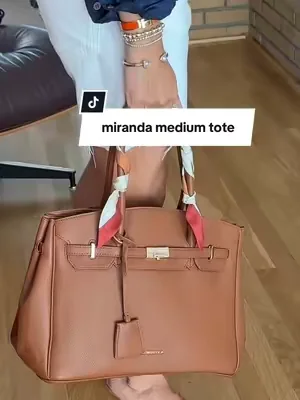 Gorgeous Miranda M tote that holds it all! Magnetic closure and slides on carry on for travel too. #dealsforyoudays #tiktokshopcreatorpicks #leatherhandbags #leathertravepurse #designerpurses@Newbella.Fashion 