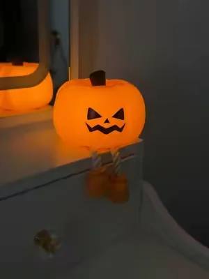 This pumpkin lamp is dimmable, rechargeable, and so cozzzy 🎃✨ #halloween #halloweendecor #nightlight 