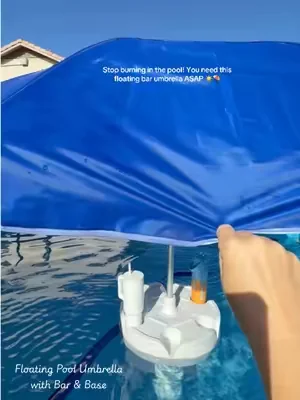 Stop burning in the pool! You need this floating bar umbrella ASAP ☀️⛱️ This Floating Pool Umbrella with Bar and Base is the game-changer your pool needs.  💦 It’s a portable pool bar table and floating poolside shade all in one!  🍹 Keep your drinks secure in the built-in cup holders, prop your phone up on the integrated phone stand for those poolside TikToks, and stay completely cool under the shade without ever leaving the water.  🎉 Perfect for pool parties, lake houses, or just relaxing in your own swimming area. It even comes with an easy carry bag so you can take the shade wherever you go! 🌴 #floatingpoolumbrella #swimupbar #DealsForYouDays #SummerWins #tiktokshopcreatorpicks 