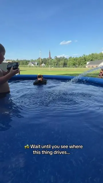 This has officially become Bryce’s favorite pool toy this summer! 🚜🌊☀️ #amphibious #rctoy #pooltoys #tractor #remotecontrolcar 